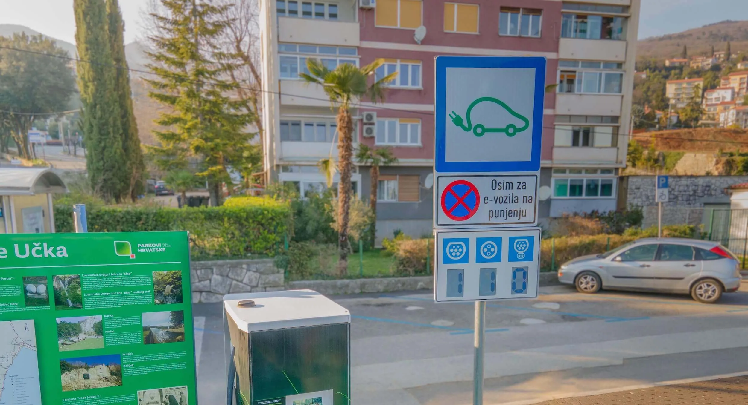 Electric car charger on the street, using Ynvisible display to show charging status